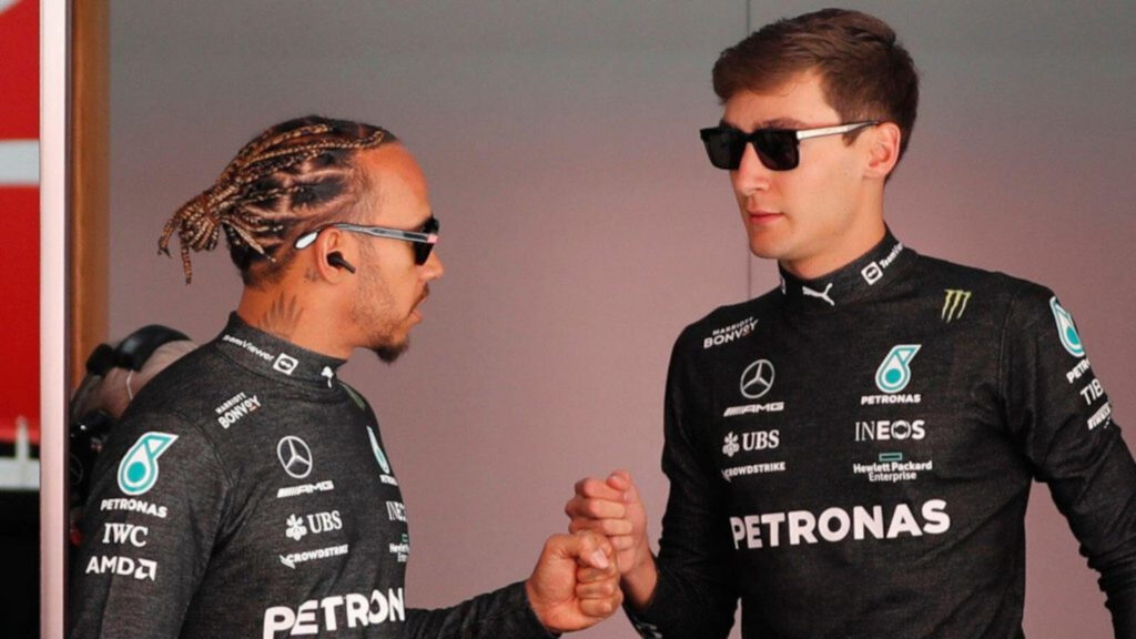 lewis hamilton and george russell fist bump in spain planetf1