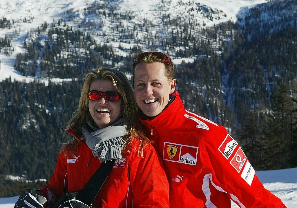 Schumacher's wife Corinna (right) has protected his privacy since he came out of a coma (Credit: Alamy)