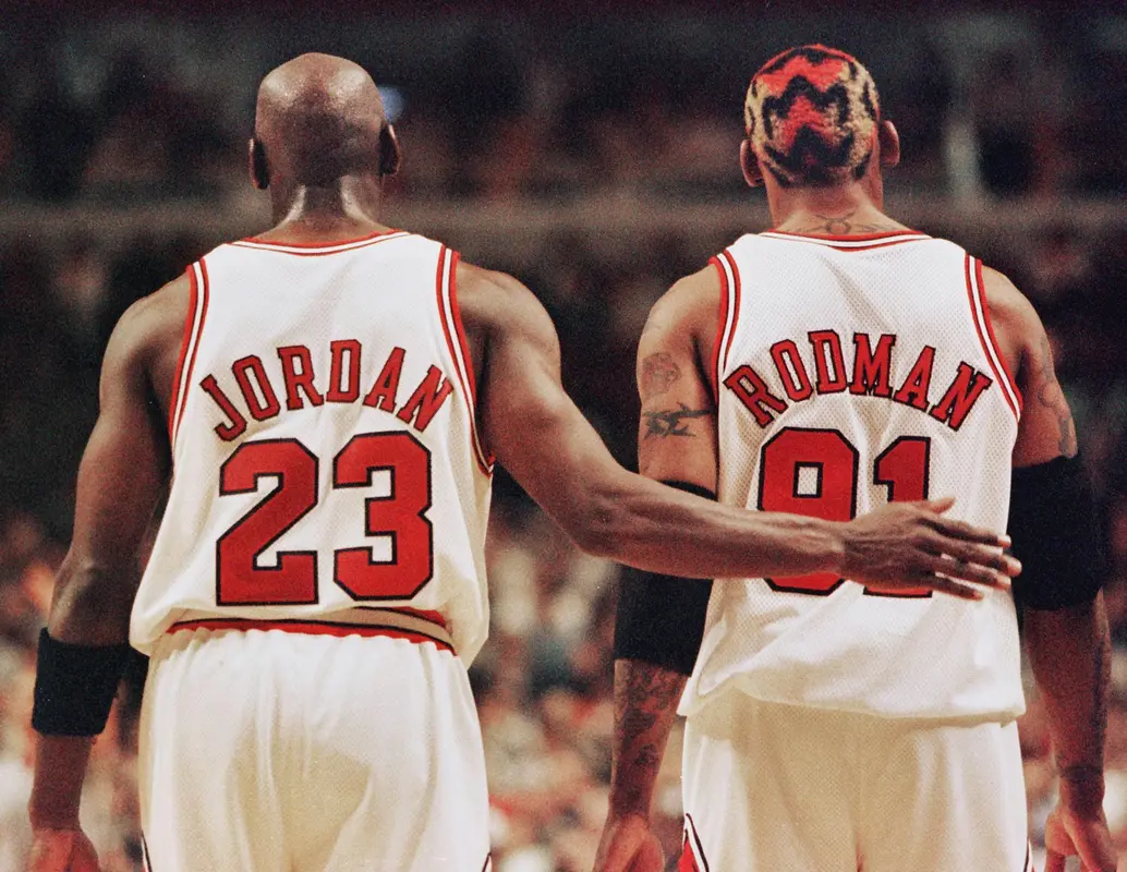 Michael Jordan pats Dennis Rodman